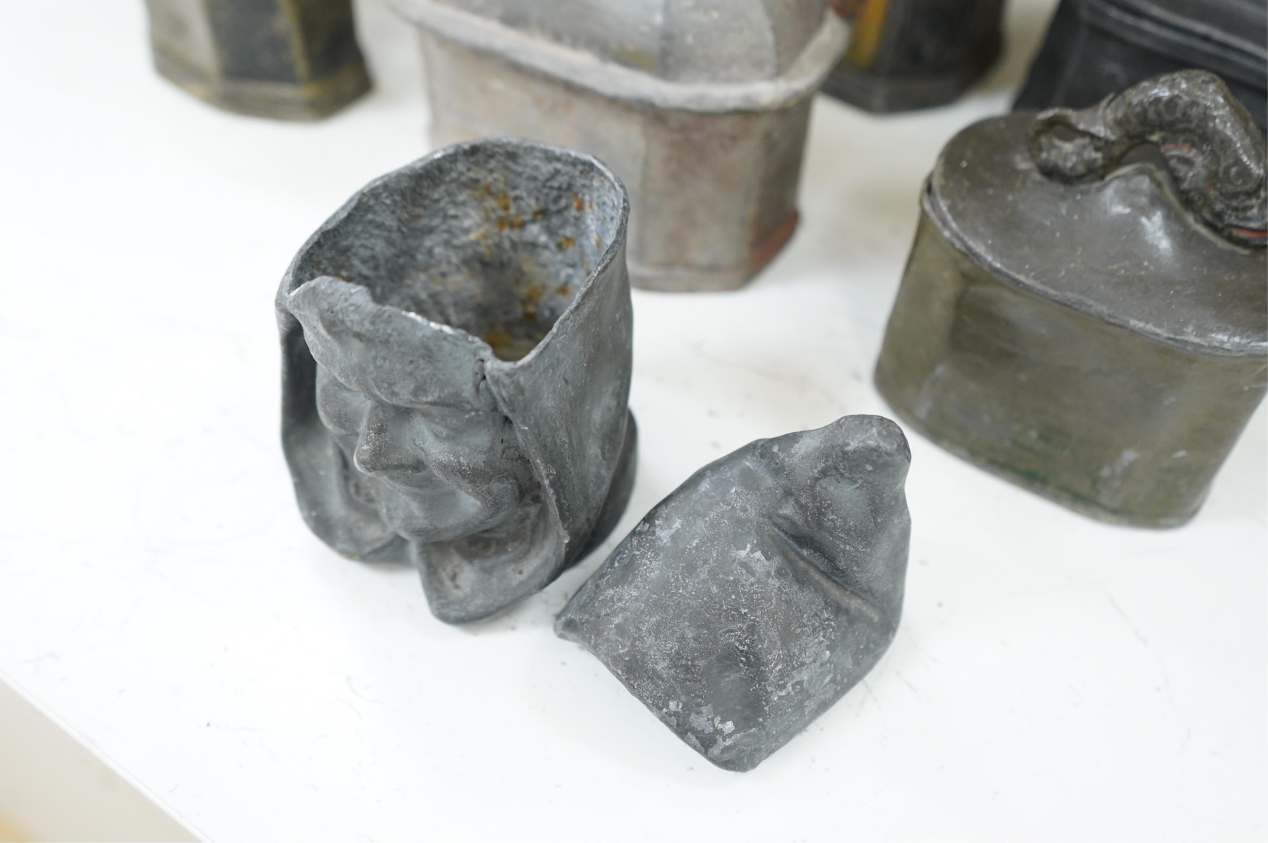A collection of ten early 19th century lead tobacco boxes to include an octagonal example with remains of paintwork, largest 19cm high